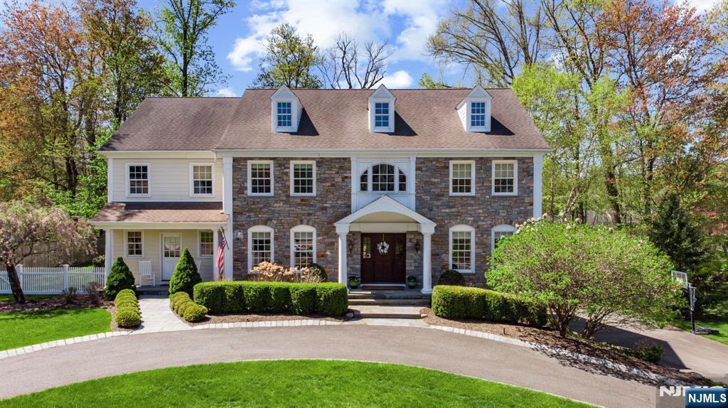 Discover timeless elegance and everyday comfort in this exquisite custom Colonial home, offering over 4,682 sq ft of refined space. From the grand two-story foyer with travertine marble floors to the formal living and banquet-sized dining rooms, every detail offers a perfect blend of luxury and timeless elegance. The gourmet chefâ€™s kitchen features top-tier appliances and radiant-heated floors, overlooking a beautiful family room with a wood-burning fireplace. Upstairs, five spacious bedrooms include a luxurious primary suite with dual walk-ins and a spa-like en-suite bath. Downstairs, the finished basement offers new carpeting, rec and fitness areas, a powder room and direct garage access. Set on .65 acres and located in a sought-after community with top schools and easy NYC access, this home blends upscale living with everyday comfort.
