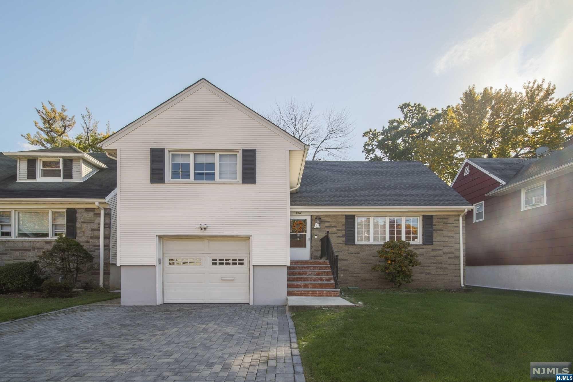 Great location! Great home! Totally renovated about 4 years ago. Open layout, 3 Bedrooms, 3 full bathrooms. New - central AC, hot water heater, hardwood floors, open kitchen with granite countertop and stainless appliances, recess lights, finished basement, huge deck, and oversized backyard. It is a half block from Fort Lee, close to all major highways, schools, and parks.