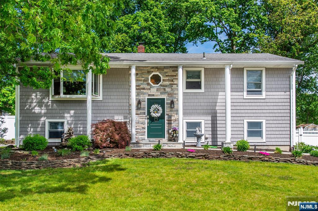 Beautifully maintained 4-bedroom home in the sought-after White Rock section of Oak Ridge! This move-in ready gem showcases true pride of ownership throughout and features a versatile ground-level bedroom currently utilized as a home office â€” ideal for guests, extended living, or remote work. Welcoming stone-faced entryway adds fantastic curb appeal, while the newer kitchen and updated bathrooms offer modern comfort and style. Sliders lead to a spacious deck overlooking the private fenced-in yard â€” perfect for relaxing or entertaining. Additional highlights include a one-car garage, driveway parking for 4 cars, newer features throughout, recessed lighting, and an ideal utility package with public sewer. Underground oil tank was professionally removed with documentation available from seller. Conveniently located near parks, lakes, shopping, and commuter routes, this lovingly cared-for home is ready for its next owners to enjoy for years to come!