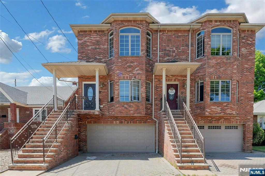 This spacious and thoughtfully designed all brick duplex offers luxurious living with 3/4 bedrooms and 3.5 bathrooms. Featuring 8 and 9 foot ceilings throughout, the home boasts an open and airy feel. The expansive living room is ideal for entertaining, complete with a cozy gas fireplace with a heat blower. A formal dining room provides the perfect setting for gatherings, while the stunning eat-in granite kitchen features a large center island ample space for casual dining and entertaining. The primary suite showcases cathedral ceilings, his and her walk-in closets, and a spa inspired bathroom with a Jacuzzi tub and separate shower. Two additional bedrooms offer walk-in closets, along with a conveniently located washer/dryer and hallway storage closets. The ground level, with its own private entrance, includes family room an office/bedroom, a full bathroom with tub, one walk-in closet, and two additional hallway closets. Additional highlights include a two-car garage and a deck with breathtaking westerly views, perfect for relaxing and enjoying sunsets. Conveniently located within walking distance to NYC transportation, this exceptional duplex seamlessly blends modern luxury, comfort, and convenience.