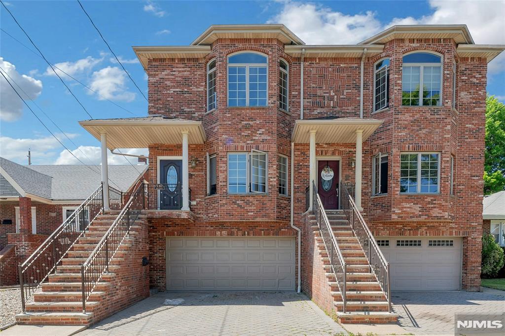This spacious and thoughtfully designed all brick duplex offers luxurious living with 3/4 bedrooms and 3.5 bathrooms. Featuring 8 and 9 foot ceilings throughout, the home boasts an open and airy feel. The expansive living room is ideal for entertaining, complete with a cozy gas fireplace with a heat blower. A formal dining room provides the perfect setting for gatherings, while the stunning eat-in granite kitchen features a large center island ample space for casual dining and entertaining. The primary suite showcases cathedral ceilings, his and her walk-in closets, and a spa inspired bathroom with a Jacuzzi tub and separate shower. Two additional bedrooms offer walk-in closets, along with a conveniently located washer/dryer and hallway storage closets. The ground level, with its own private entrance, includes family room an office/bedroom, a full bathroom with tub, one walk-in closet, and two additional hallway closets. Additional highlights include a two-car garage and a deck with breathtaking westerly views, perfect for relaxing and enjoying sunsets. Conveniently located within walking distance to NYC transportation, this exceptional duplex seamlessly blends modern luxury, comfort, and convenience.