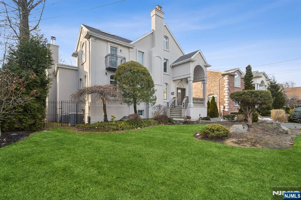 1089 Briar Way is a beautifully designed home located in the heart of Fort Lee! This spacious residence offers a perfect blend of comfort and convenience, just minutes from NYC. The main level features a bright kitchen, dining room with large doors leading to a raised deck, and two additional living spaces. Upstairs, the primary suite boasts a walk-in closet with built-ins and a luxurious private bathroom, plus two additional bedrooms and another full bath. The third floor is ideal for a home office, creative space, or guest suite while still allowing room for a king sized bed, if needed. The fully finished basement offers heated floors, a full bath, laundry, and backyard access. A fenced yard, two-car garage, and ample storage complete this exceptional home. Enjoy top-rated schools, nearby parks, and easy access to major highways, the GWB, and public transit for a quick commute to NYC.