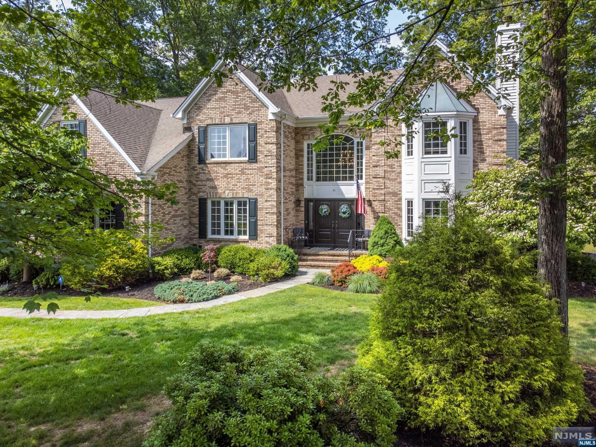 Welcome to Canterbury Pointe in Denville! This stunning center hall colonial has 4 bedrooms and 2.5 baths and offers ample space for comfortable living. As you enter, you'll be greeted by a grand 2-story foyer, setting the stage for the elegance that lies within. The main level has a formal living and dining room with hardwood floors and elegant moldings. The heart of the home lies in the eat-in kitchen, complete with a center island with granite countertops. Adjacent to the kitchen is the family room with a vaulted ceiling and a cozy gas fireplace, making it the perfect space for relaxation and entertaining. Upstairs you'll find the spacious master suite that features a gas fireplace, tray ceiling, two walk-in closets, and an en-suite bathroom. The second floor also includes a hall bathroom and 3 additional bedrooms. Step outside where you'll find a pool, patio, and a deck area, this outdoor space offers endless opportunities for relaxation.