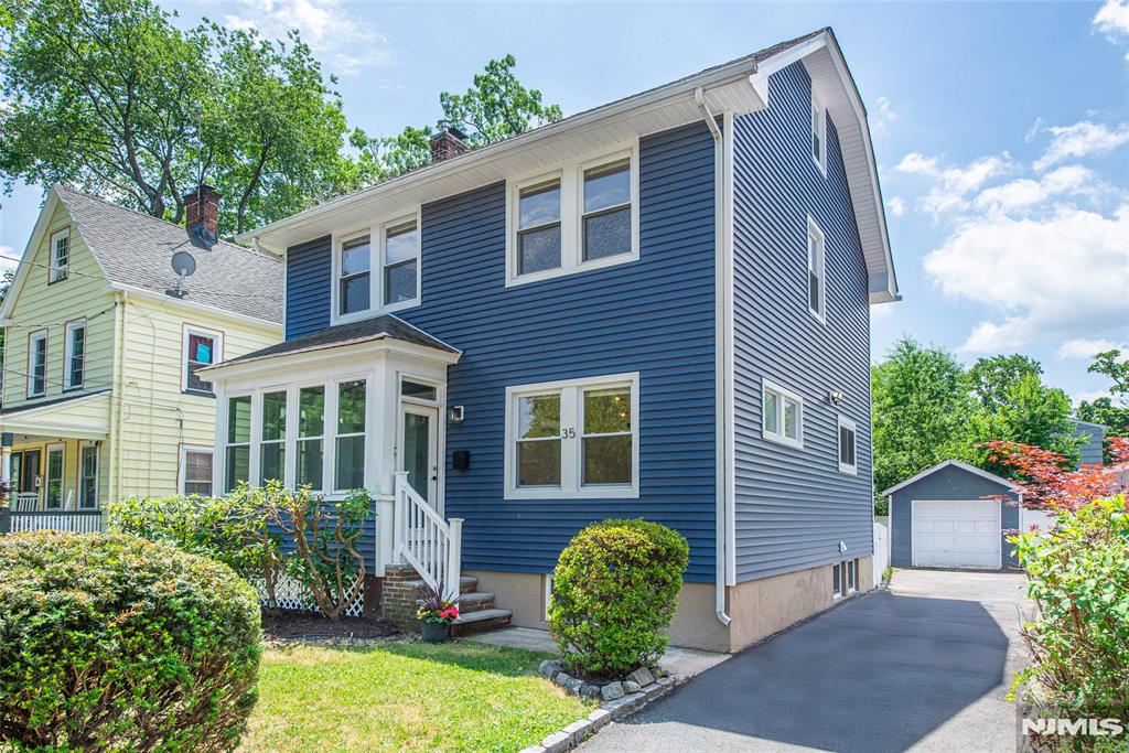 Tucked away on a quiet cul-de-sac near Montclair's sought-after Estate Section, 35 Howe Street offers a move-in ready opportunity in a prime location ideal for first-time buyers, downsizers, or anyone seeking comfort and convenience. Enjoy mornings on the enclosed front porch with additional built-in storage before entering this inviting Colonial featuring hardwood floors throughout and so much style. The spacious living room, anchored by a wood-burning fireplace, creates a warm and welcoming atmosphere. Sliders open to a generous deck overlooking a fully fenced-in, manicured backyard perfect for entertaining, outdoor activities, or relaxing evenings.The main level flows into a formal dining room filled with natural light and stylish touches, followed by a kitchen with granite countertops, stainless-steel appliances, and a functional layout for everyday living. A charming powder room adds convenience, while the unfinished lower level offers excellent potential for recreation, gym, or storage.The second floor features three comfortable bedrooms and a refreshed full bath with neutral finishes. A finished third-floor bonus space provides flexibility for a home office, guest suite, or creative use. Central air conditioning, new boiler and thoughtful updates enhance comfort and value. Just minutes from downtown Montclair, parks, dining, and cultural attractions, this home combines charm, functionality, and an exceptional location in one of New Jersey's most desirable communities.