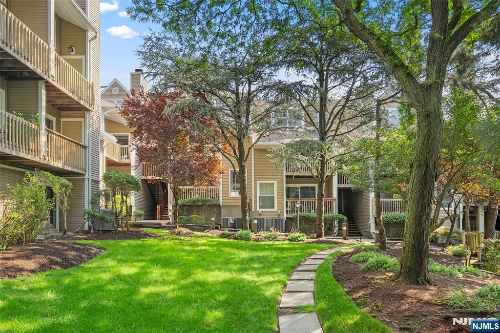 Welcome to Windsor Square!! 2BR & 3FBTH with attached garage and 1 assigned outdoor parking space. Main level has living room with fireplace, balcony, dining area, kitchen, primary bedroom w/primary bathroom, second bedroom, and full bath. Ground level has separate entrance door, family room, full bath, and garage. Approximately 1,393 sq. ft. Bedrooms are not on the ground floor. Amenities include a clubhouse, gym, and outdoor pool. Ready to move in.