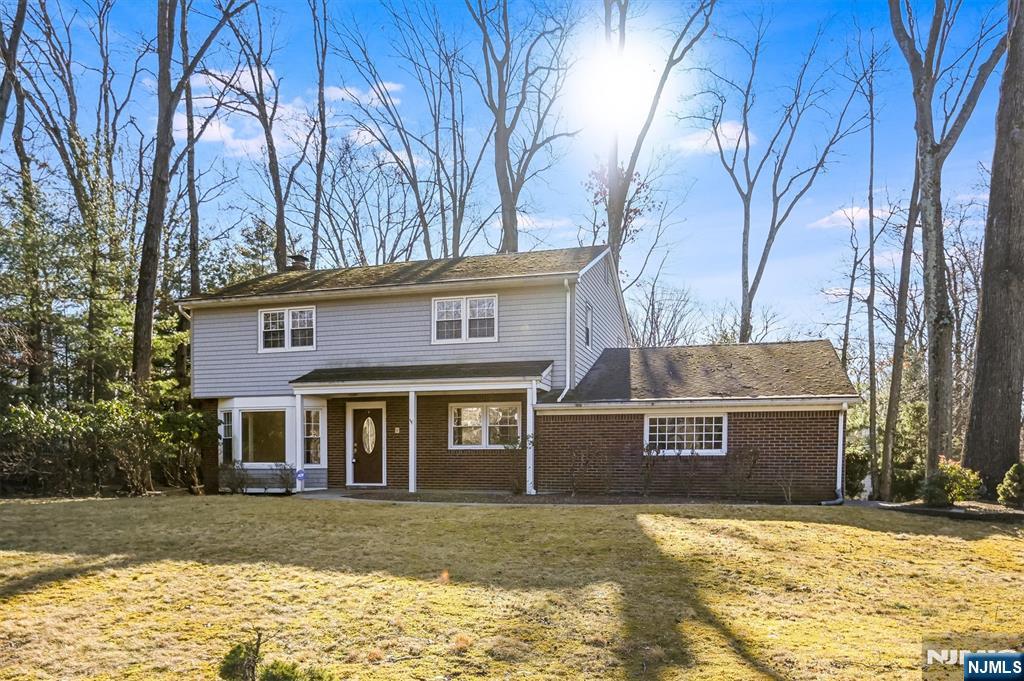 Classic Center Hall Colonial offering timeless design, generous living space, and exceptional expansion potential. This 4-bedroom, 2.5-bath home features a traditional floor plan with hardwood and tile floors throughout, recessed lighting, and beautifully proportioned rooms ideal for both everyday living and entertaining. The oversized living room is highlighted by a wood-burning fireplace with an elegant Georgian marble hearth and surround, while the formal dining room provides a perfect setting for gatherings. The move-in-ready eat-in kitchen opens to the family room and a charming three-season porch overlooking the backyard. Upstairs, the spacious primary suite includes a private en-suite bath, complemented by three additional light-filled bedrooms and a large hall bath. The finished walk-out basement offers flexible space for recreation, home office, or future customization. Additional features include a two-car attached garage and a large lot set toward the end of a quiet cul-de-sac, offering privacy and room to grow. Enjoy River Valeâ€™s sought-after schools, prime location, and the opportunity to make this exceptional home your own.