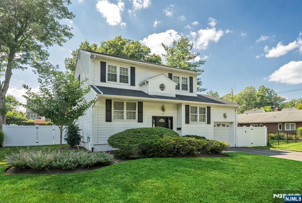 Move right in to this updated 3 bedroom home featuring 2 full baths and 1 half bath. Step inside to find a home with refreshed finishes and updates throughout all 3 floors. The showstopper MEIK offers an open layout to a large, family room along with SS appliances, quartz counters, an oversized island with storage cabinets underneath and a door to the updated deck, overlooking the fully fenced beautiful backyard, perfect for relaxing or entertaining. You will love the flexibility of a private office with a private entrance, accessible from the new deck; ideal for working from home or studying. Thoughtful finishes and design throughout continue on the 1st floor with the updated half bath, dining room, currently being used as an additional playroom and a spacious living room with modern fireplace. 2nd floor provides 3 bedrooms, including a primary bedroom with an oversized Walk In Closet, an updated full bath with a tub, linen closet and a large landing. Ground floor is fully updated with a sizable Recreation room, gym, full bath, laundry, utility and lots of storage! Situated in a desirable neighborhood, not far from the golf course and the downtown commuter train, this home offers both charm and easy commuting, all while providing the privacy and outdoor space you are looking for.