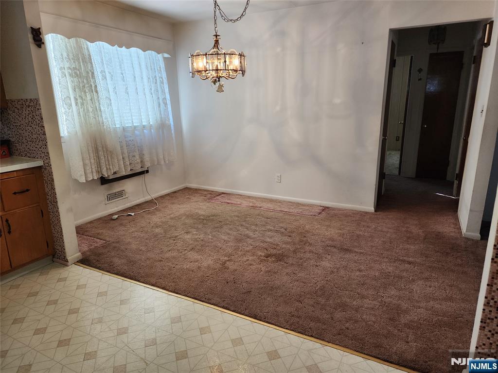 Welcome to 704 E 30th Street! This charming house is ready for a new owner to make it their own. With the potential to easily convert into a multi-family home, this property offers great versatility.Large Kitchen Includes a separate dining area, ideal for meals or entertaining. Spacious Living Room Features a picture window that allows for plenty of natural light, making the space feel open and inviting. Two First-Floor Bedrooms Conveniently located, along with a full bath on the same level .Attic is Unfinished offering a blank canvas to bring your ideas to life perfect for additional living space or storage. Partially Finished Basement Includes a summer kitchen area, adding even more potential for living or entertaining spaces. What an incredible opportunity to make this house your home!