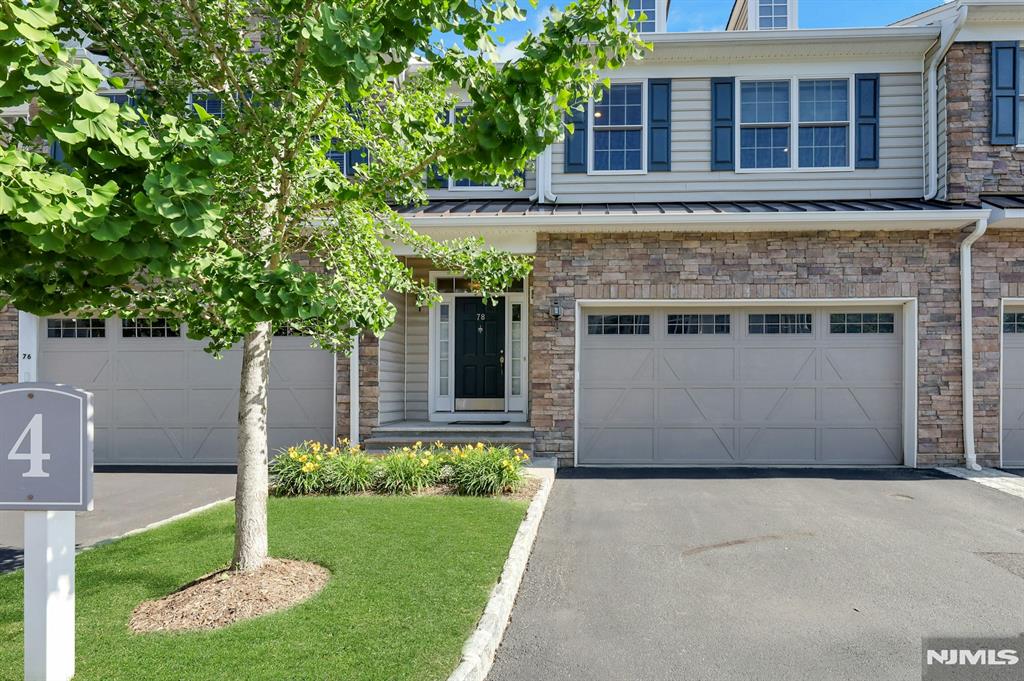 WOW! A world of extravagance & beauty await you in this Gorgeous newer townhome in desirable Reserve at Montvale community! Stunning with gleaming wood floors, this elegant home combines traditional style with modern amenities, making it the perfect space to call home. Enter into a spacious & welcoming entry hall with an open stairwell as its focal point. Continue into the open-concept great room space with high ceilings & flooded with natural light. The living room creates warmth & coziness with a gas fireplace & windows overlooking the private backyard. The dining room has a glistening chandelier & sliders to a private deck. The chef's kitchen features a huge island with seating along with granite countertops, designer glass backsplash & dark solid wood cabinets throughout. A GE wall oven and microwave, along with a 5-burner GE Cafe cooktop makes cooking in this kitchen a breeze. A butlers pantry makes a fantastic coffee bar while the built-in desk area is ideal for working from home. The walk-in pantry offers plenty of storage as well. The second floor opens to a spacious loft area, large enough to host a home office or another lounge seating area. The primary suite is stunning in every way, with an enormous wardrobe room & updated en-suite bathroom, complete with a corner soaking tub, walk-in shower and double vanity. 2 additional bedrooms, bath & laundry on this level. The basement is unfinished and plumbed for a future bathroom. Hurry! Must see!