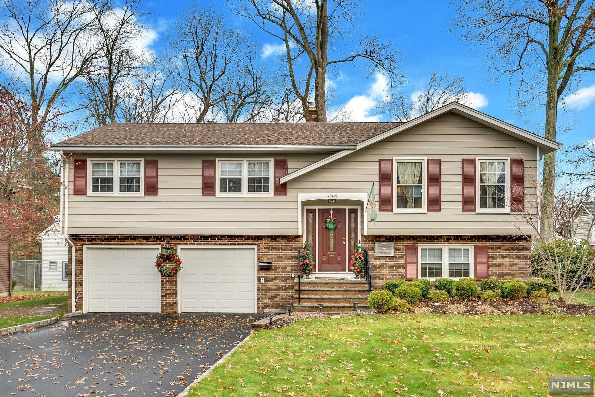 You don't want to miss this spacious 3 bedroom, 2 1/2 bath updated home nestled on a quiet street. Great curb appeal invites you inside this sun-filled home featuring an entry foyer, large living room, dining room, new updated EIK, primary bedroom with updated full bath plus 2 additional bedrooms & second updated full bath. Ground floor family room with private office, laundry room, half bath and access to the attached 2 car garage. Sliding doors in the dining room lead to a large deck and patio that is ideal for entertaining. Lots of amenities including hardwood floors, central A/C, multi-zone heat, newer roof, hot water heater & furnace, interior/exterior surround sound speaker system, whole house water softening system and many more! Ideally located near transportation, parks, shopping & a Blue Ribbon elementary school. Perfect for extended family living. Nothing to do but unpack your bags! This is a true gem in the sought-after town of Waldwick.