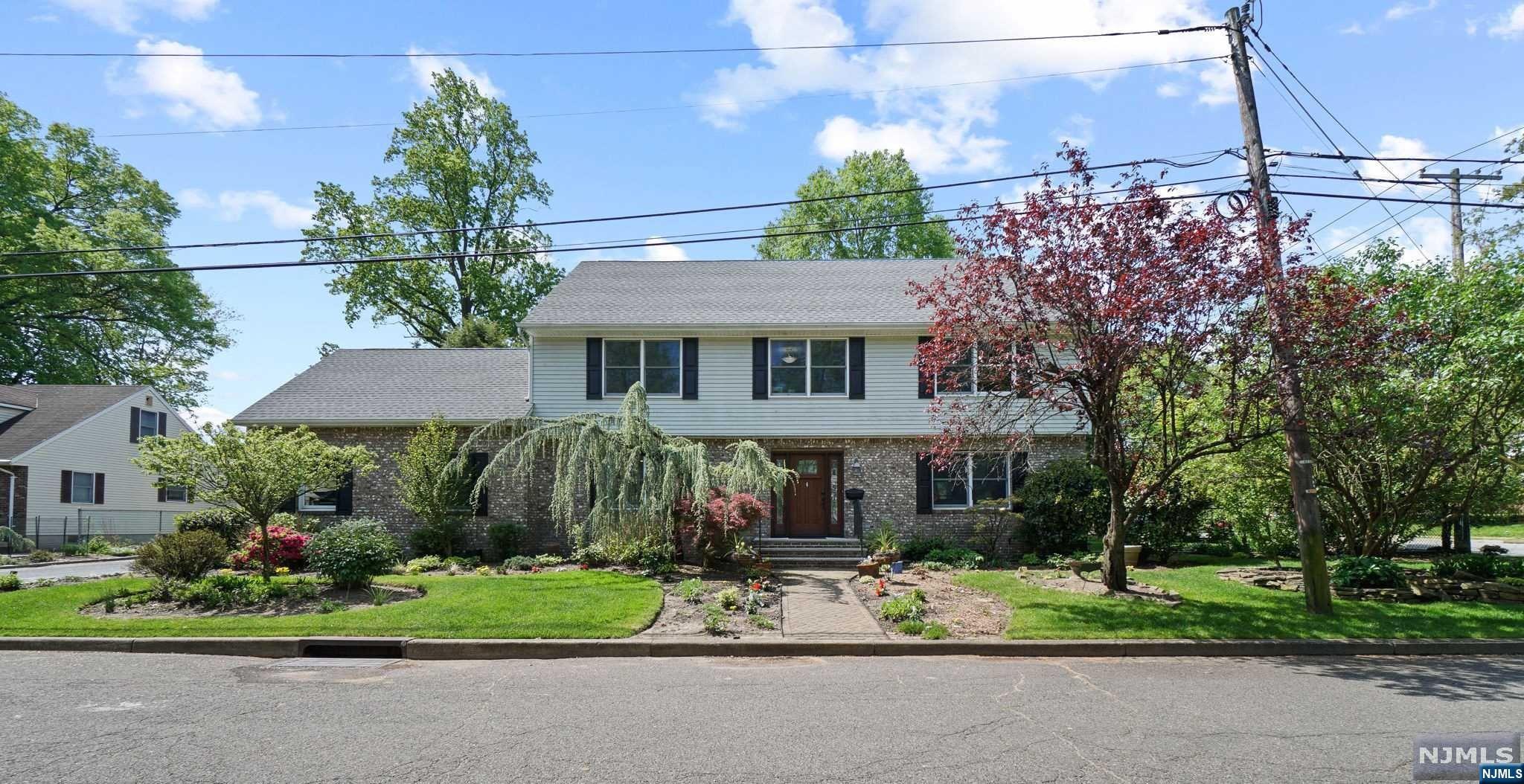 Welcome to this move in ready center hall col. w/ lush landscaping and great curb appeal. Ft 5 BRs, 3.5 baths & over 4000 sqft of livable space. Situated on a private dead end st. & only seconds from Top Schools, downtown Tenafly & NYC, this home offers an open floor plan w/HDWD floors throughout. The LR & FR are made for spending time w/Family & friends. The oversized DR flows seamlessly into the gourmet KIT ft SS appl, center island & breakfast area w/ access to the deck. The 2nd floor offers an expansive primary BR suite w/vaulted ceilings, outfitted WIC the size of a bedroom w/center island & lush primary bath. 3 ADD'L generously sized bdrms all w/large outfitted closets & full bth complete the 2nd level. The 3rd floor fts a large bonus room/BR w/addl. storage. The finished LL offers a rec rm, 2 bonus rms, a full bth & laundry rm. The fully fenced backyard is a true oasis w/large deck, outdoor covered BBQ, a garden & beautiful landscaping. Enjoy a new roof and other updates!