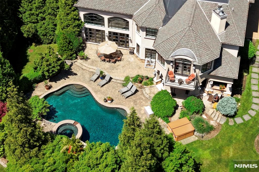 Lifestyle Meets Luxury Privately set on nearly an acre of beautifully landscaped property, this impressive custom CHC offers approx. 11,000 sq ft of exceptional living space, including a finished lower level, in one of USRâ€™s most sought-after locations. A dramatic two-story foyer opens to elegant interiors designed for grand entertaining and comfortable everyday living. A spacious family room, formal dining room, and intimate living room flow seamlessly into a spectacular chefâ€™s kitchen featuring Wolf and Sub-Zero appliances, dual islands, and a butlerâ€™s pantry. The home features six spacious bedrooms, each with en-suite bath accommodations, including a luxurious primary suite with sitting area, floor through fire place and spa-inspired bath. The resort-style backyard is the true showpiece, featuring a heated gunite pool, spa, waterfall, outdoor kitchen, covered patio with television, and extraordinary outdoor living spaces designed for unforgettable entertaining and the ultimate private retreat experience. Additional highlights include a private office with custom built-ins, wine room, theater room, and multi-car garage. Conveniently located near top-rated schools, major highways, shopping, dining, and just 30 miles from Manhattan, this remarkable estate offers luxury, privacy, and an exceptional lifestyle. Experience resort-style living every day. Don't you deserve the best? Schedule your private tour today.