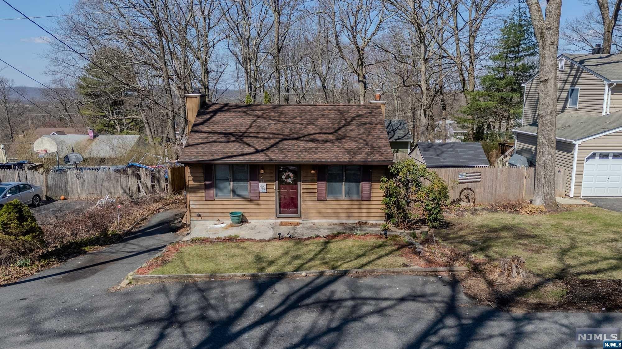 Welcome to 14 Hickory Drive, a charming abode nestled in the heart of Stanhope, NJ. This delightful Ranch style home offers 2 bedrooms with ample closet space and 1 full bathroom, a generously sized eat-in kitchen with a skylight to bring in extra natural light, and a partially finished basement just waiting for your finishing touches to turn it into the ultimate Rec room/Man Cave! Plenty of room for storage available as well. Outside, a private outdoor space awaits! Complete with a fenced-in backyard with a large deck that is perfect for entertaining - Or use it as your tranquil oasis for al fresco dining, morning coffees, or simply basking in the fresh air. Make Stanhope your new home today!