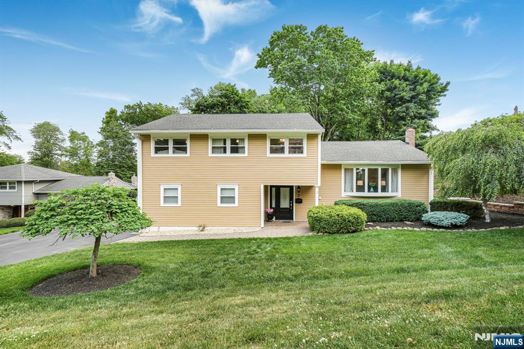 Best & Final offers are due by Tuesday,6.2, by 5pm. Welcome home to this beautiful 4 bed, 2.5 bath home tucked away on a quiet cul-de-sac walkable to Blue Ribbon Fallon Elementary School. Lovingly cared for by the current owners, this home reflects years of thoughtful maintenance, upgrades,& pride of ownership. Step inside & appreciate the freshly painted interior, newer entrance tile flooring, and 1st floor airy open-concept layout designed for today's lifestyle. The bright white kitchen features a new stainless steel stove, center island with seating and prep space, skylight, soaring ceilings, and seamless flow into the dining area and spacious living room with hardwood floors. Sliders open to a large two-tier deck overlooking the flat, fully fenced backyard with black metal fencing, creating ideal indoor/outdoor living and entertaining space. Upstairs offers spacious bedrooms including a primary suite with walk-in closet and ensuite bath. The ground level features a welcoming foyer, powder room, oversized laundry room with outside access, & large family room with sliders to the backyard. Basement offers flexible bonus spaces for a den, gym, office, game room, or storage. Additional highlights include 2-car garage, upgraded 200 amp electrical service & breaker box, roof (2014), sump pump (2024), retaining wall & drywell installation, whole house generator (2026) + Conveniently located near Whole Foods, NYC transportation, shopping, restaurants, parks, major highways & more.