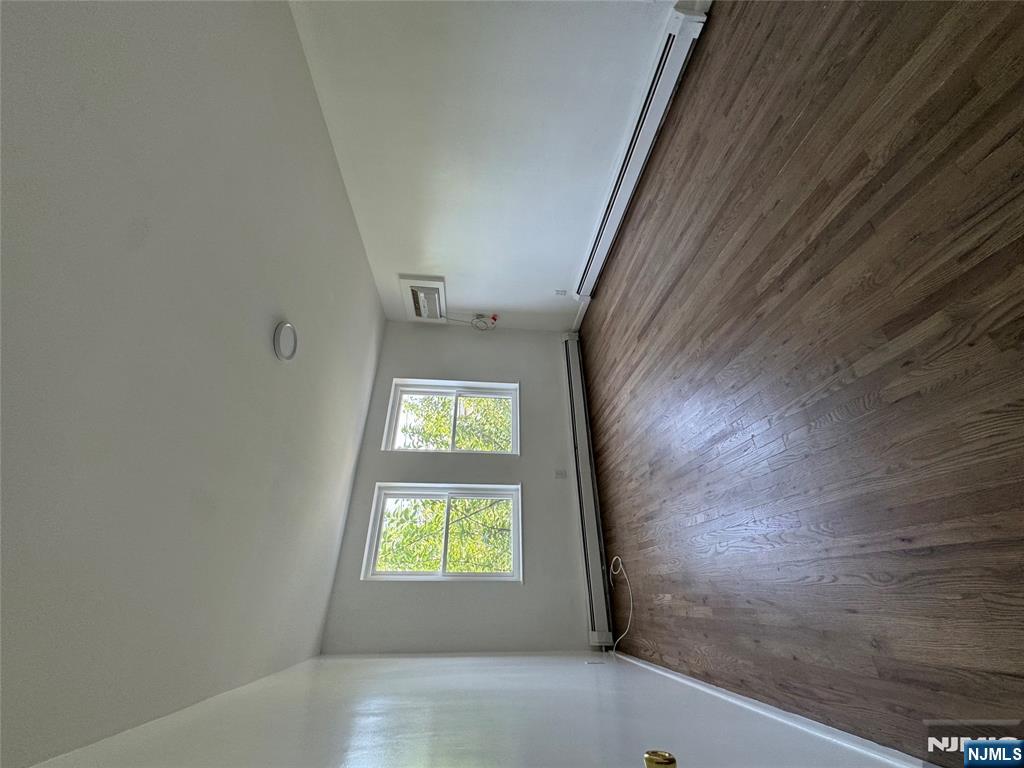 Check out this awesome 2nd floor 1 bedroom apartment. Located in the Arlington section of Kearny. Close to nyc transportation, shopping, and stores. No pets. No smoking. Hardwood floors. Wall ac included. Designated parking spot included.
