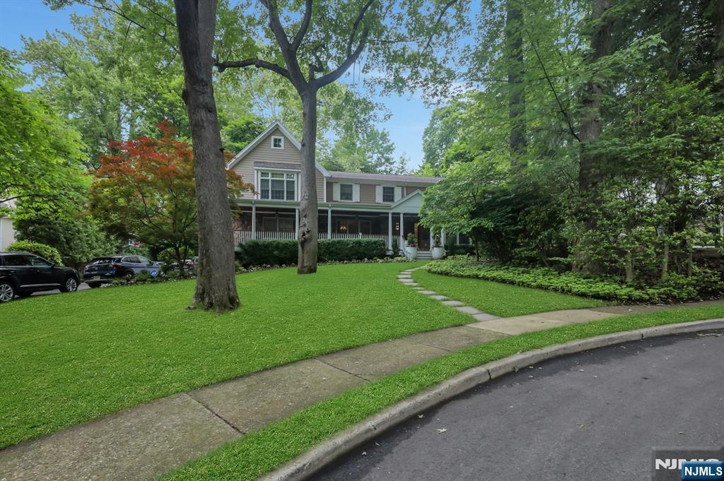 Exceptional Center Hall Colonial Living. Some homes simply have it all. Nestled on a coveted private cul-de-sac, this stunning 5-bedroom, 4.5-bath center hall colonial delivers the rare combination of effortless elegance, generous space, and resort-caliber amenities. The moment you enter, this home's exceptional flow sets the tone. Every room feels intentional, every space is built to live â€” and to entertain â€” beautifully. Chef's Kitchen & Great Room The chef's kitchen is a true showpiece: oversized and outfitted with two ovens, two dishwashers, and three sinks, it opens seamlessly into a stunning great room complete with a wet bar and custom built-ins. Primary Suite-The primary suite is a sanctuary unto itself â€” featuring soaring double-height ceilings in the seating area, a generous walk-in closet, and a spa bath with the ultimate luxury: radiant heated floors. All five bedrooms are impressively sized, offering comfort and privacy for family and guests alike. Lower Level - Descend to the lower level, where the home transforms into something extraordinary. A temperature-controlled wine cellar, a billiards room, and a full in-home spa â€” with both dry and wet sauna and its own wet bar â€” await. This is not a basement. This is a destination. Location Truly walkable to houses of worship, public transportation, and the heart of town. Convenience meets luxury at every turn.