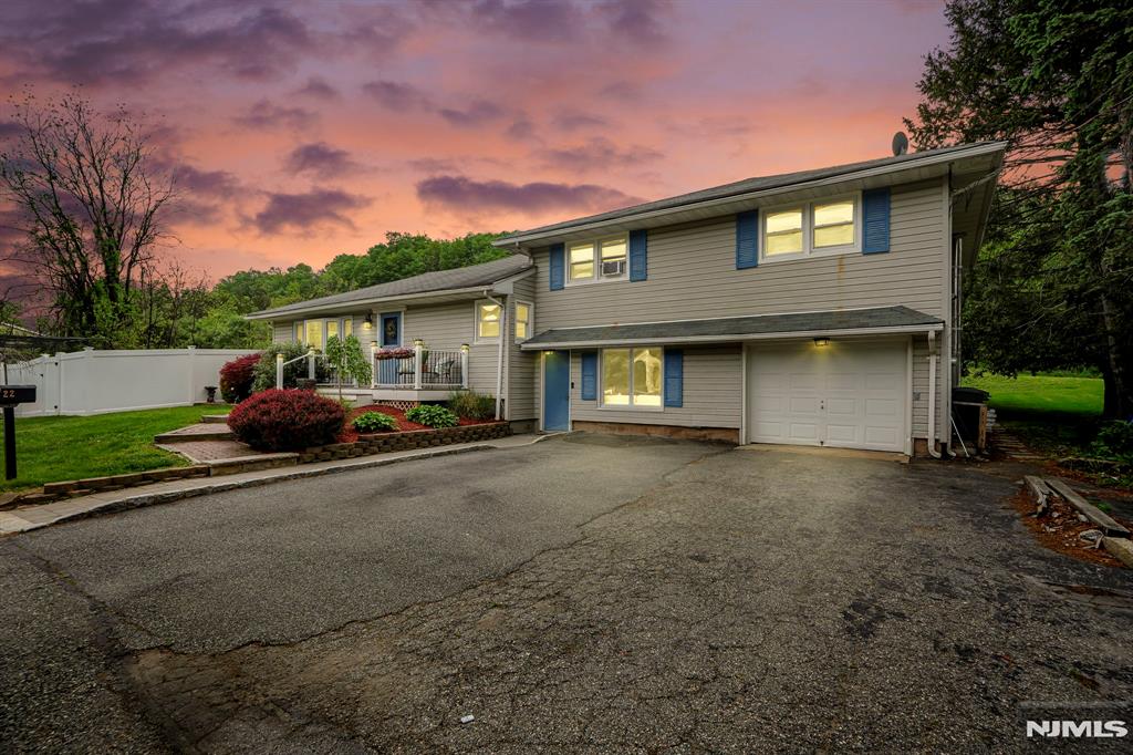 Nestled in desirable Pompton Lakes, this charming 4-bedroom split-level offers space, character, and great entertaining opportunities both inside and out. The open-concept main living area features soaring ceilings in the kitchen, exposed stone accents, a spacious living room with pocket doors, dining area, and cafe style seating space filled with natural light. A first-floor bedroom and nearby full bath provide flexible living options. The lower level includes a welcoming family room with large picture window, laundry area, and home office. Upstairs offers 3 spacious bedrooms and a full main bath. Looking for extra fun space? â€œThe caveâ€ is the perfect escape for game nights, hobbies, or relaxing. Enjoy the fenced-in backyard complete with deck and gazebo, lower patio, above-ground pool, and outdoor bar area made for entertaining. Conveniently located near Pompton Lakesâ€™ charming Main Street shops, restaurants, schools, parks, and NYC transportation.