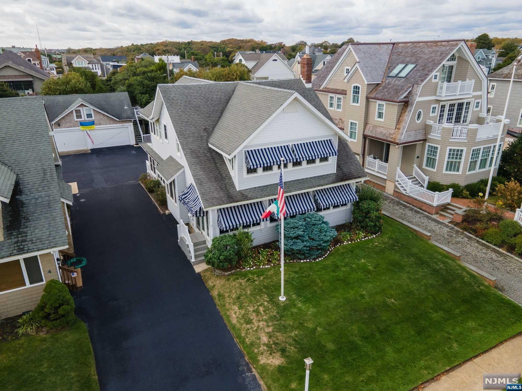 It doesn't get better than this! This is the home and location you've been waiting for. Rarely does a property this close to the ocean become available in a town as sought after as Sea Girt. Just a few doors from the beautiful Sea Girt beaches, no streets to cross, beach access as you reach the boardwalk. Well maintained Victorian, traditional sea shore home. Four bedrooms, wrap around enclosed back porch that leads to the deck. Front porch is also enclosed, as is the upstairs porch with view of the ocean, just down the street. Apartment over the garage with kitchenette and full bath. Bright, sunny and oh so welcoming, this is the house and location of your dreams. Don't miss out on the rare, ocean block opportunity.