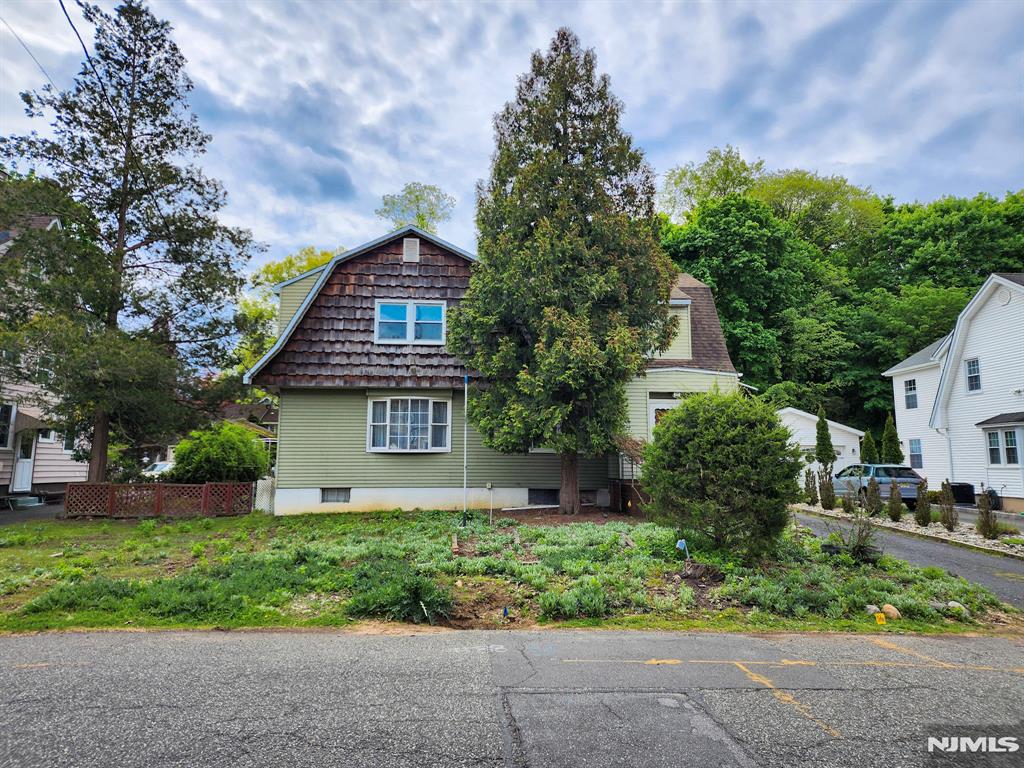 Located in a sought after neighborhood of Harrington Park, this expanded colonial features generously sized rooms. Spacious 3 bedrooms, 2 full bathrooms and tons of storage. An unfinished ample basement with a high ceiling is perfect for storage or great space to finish and add to your overall living area. Updated utlities and electric. This is a wonderful opportunity to move in to Harrington Park with it's highly rated blue ribbon schools, many parks and charming downtown. Make this home your own! Sold AS-IS