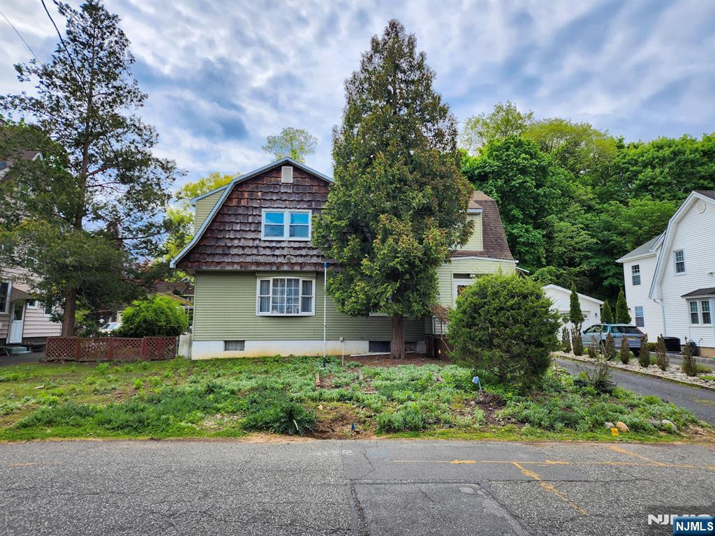 Located in a sought after neighborhood of Harrington Park, this expanded colonial features generously sized rooms. Spacious 3 bedrooms, 2 full bathrooms and tons of storage. An unfinished ample basement with a high ceiling is perfect for storage or great space to finish and add to your overall living area. Updated utlities and electric. This is a wonderful opportunity to move in to Harrington Park with it's highly rated blue ribbon schools, many parks and charming downtown. Make this home your own! Sold AS-IS