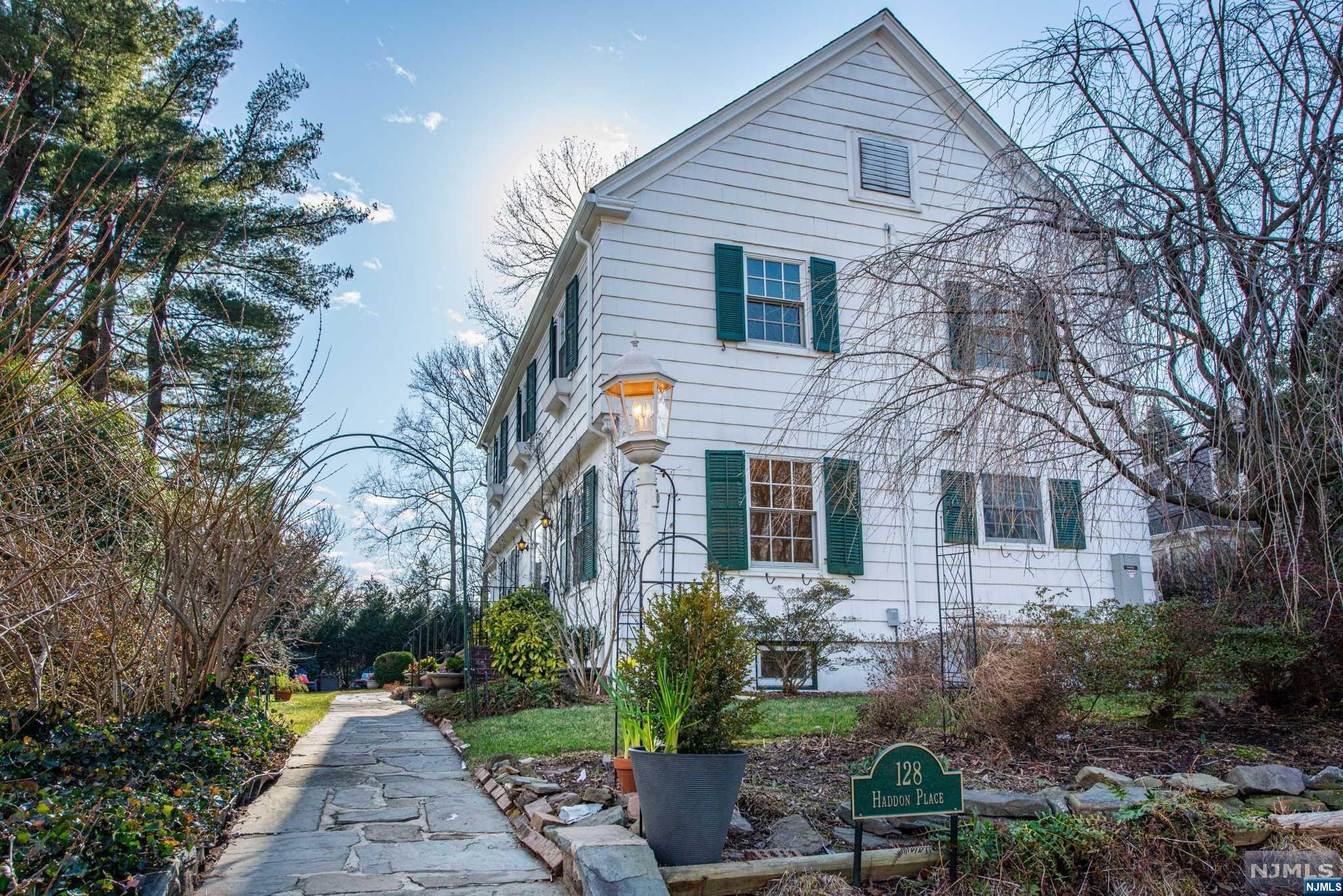 A home to fall in love with! This magical English cottage is a sparkling gem, located on one of UM's prettiest side streets, just a short walk from UM shops, restaurants, NYC train/bus & 121-acre Brookdale Park. #128 has been meticulously updated, renovated & maintained with pride & so much love. All freshly painted w/ sun pouring in from every angle & gorgeous architectural features: original wood floors, arched moldings, window seats & 12 fabulous closets. Sun-drenched LR has wood-burning FP & opens to a screened porch overlooking gorgeous yard brimming w/ stunning perennials & grasses. A renovated eat-in kitchen has ss appliances, granite counters, wood cabs, Marmoleum flrs, & walk-in pantry. A 1st flr powder rm is perfectly situated off the hall & there is a formal DR. Primary bed w/ ensuite bath. There's 3 addtl beds & 2 addtl full bths. Updates include new Pella/Anderson windows throughout, new roof, CAC on 2nd + 3rd flr, whole house generator, 2-car garage w/ electricity.