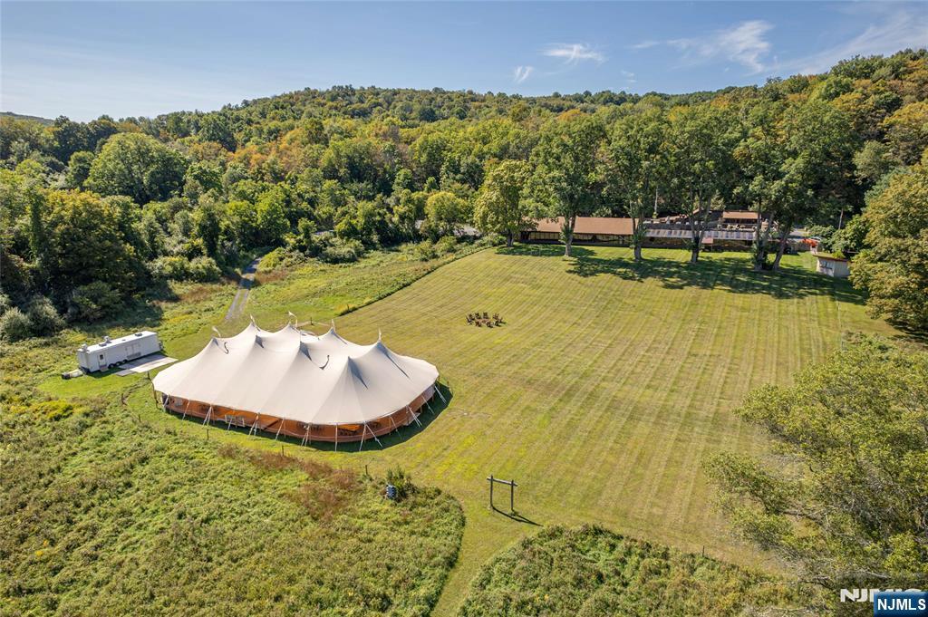 Iconic NJ Restaurant Destination for sale. Owned by the same family since 1949, the restaurant and event facility has been a dining destination for generations. Large operating restaurant business and event business that has been thriving for decades. Over 1000 feet of frontage on the flat brook river. Surrounded by the 65,000- acre Delaware Water Gap National Recreation Area, this property is a secluded sanctuary with limitless potential. The existing structure offers ample space to build out guest rooms, creating a boutique inn, a premier corporate retreat, or a wedding venue. Open fields and beautiful views, ideal for equestrian use as well. World-class hunting, plus swimming and fishing on the adjacent Flat Brook.