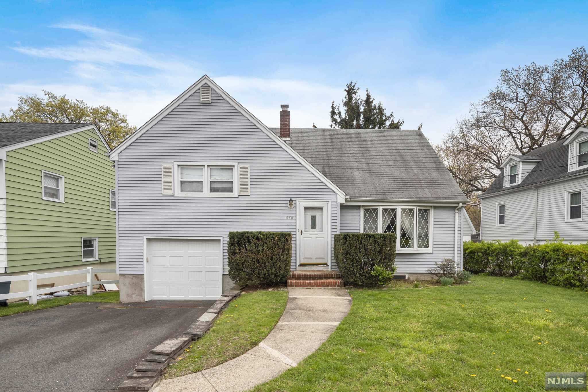 Great location, spacious Maywood Split-Level home on beautiful huge property backs up to nature preserve! Features include great floorpan with spacious living room with bay window, open to dining room, kitchen open to den addition. Upstairs are 3 good size bedrooms and a full bathroom. Downstairs is access to the attached garage, laundry room, half bath, and big family room/rec room with built in bar and decorative fireplace, sliding doors to huge oversized backyard. Perfect candidate for your custom makeover project! Close to NYC express transportation, in the heart of Bergen County convenient to everything. Don't miss it!