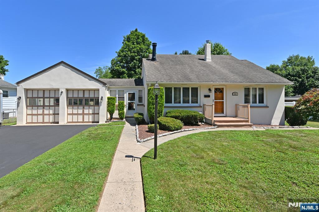 Welcome to this beautifully maintained Cape Cod-style home, featuring three bedrooms and two and a half baths, all complemented by excellent curb appeal. Upon entering, you will be greeted by a cozy living room adorned with a wood-burning fireplace. The spacious kitchen, located directly behind the living room, is designed to accommodate a large dining table, making it perfect for gatherings. Additionally, the first floor includes a full bath, a bedroom, and a dining room that can easily be converted into a fourth bedroom if additional space is required. The second level features two generously sized bedrooms, each offering ample closet space, along with an additional full bathroom. The walk-out basement boasts impressive ceiling height and includes a half bathroom, a family room, and laundry facilities. There is also extra space that can be utilized as a gym or office. In addition, the property features a two-car garage connected by a charming breezeway, which can be enjoyed year-round. Adjacent to the breezeway is a two-level deck that provides views of the manicured backyard.