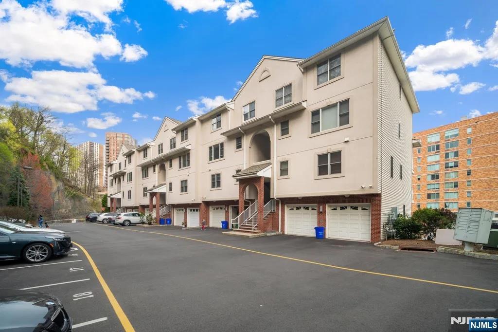 Approx. 1,464 sq ft 2BR/2.5BA townhouse-style condo in the heart of Edgewater. This bright, updated unit features hardwood floors, recessed lighting, and a modern white kitchen with granite countertops. Private terrace off the living area. In-unit laundry with full-sized washer/dryer. Central A/C. Attached 1-car garage plus 2 additional outdoor parking spaces. Prime location close to NYC buses, ferry, GW Bridge, and Lincoln Tunnel. Move-in ready. Won't last long!