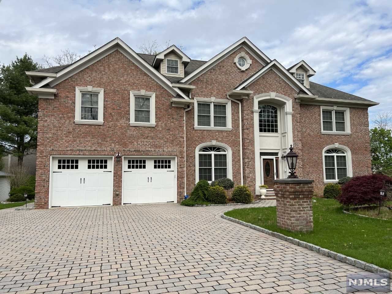Don't delay seeing this 4 Bed, 5 Bath Brick front Colonial with over 4,550 sf of living space including the full finished basement. The 2-Story Porcelain-tiled Entrance Foyer opens to the Formal Living and Dining Rooms. Large Modern Eat-in Kitchen with separate Breakfast area and Pantry Closet, Family Room with Fireplace, Powder Room, Mud Room and Garage entrance. 2nd Floor features Master BR with Sitting Room and Walk-in Closet, Master Bath has Bidet, Shower and Jetted Tub, 3 additional BR's, Bath and Laundry Rm. Fully finished 3rd Flr features Office, Sitting Rm and Storage. Full Finished Basement has Kitchen, Breakfast Rm, Rec Rm, Half Bath, Storage and Utility Rm. Many extras to see. Close to schools, Houses of Worship, Shopping and Easy access to transportation.