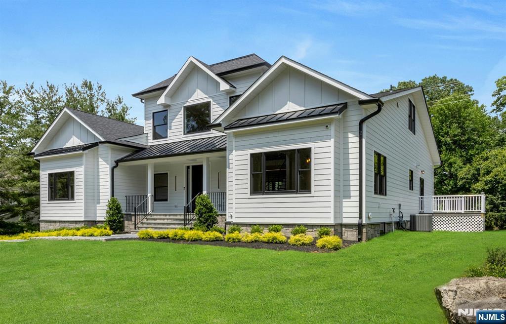 A Hidden Gem of Exquisite Design & Exceptional Amenities, this Luxury New Construction/Existing Foundation is nestled on a Quiet Tree Lined Cul-de-sac in the Heart of Ramsey on a 0.5acre Flat Lot. Modern Elegance, Outstanding Quality & Expert Craftsmanship define this Sophisticated On Trend CH Colonial featuring Open Floor Concept Flooded w/Natural Light. Comprising ~6300sf of Finished Interior Space across 3 Levels, this Home offers 6BR, 7Bath & 3 Car Garage. 2Sty EF opens into Vaulted GreatRm focused on Floor2Ceiling SGD System to Covered/Coffered Lanai w/Outdoor Cooking Center & Gas FPL o/lookn Large Open Backyard. Kitchen w/Center Island & BarStool Seating is appointed w/Quartz Counters, Custom Cabinets, Top of Line SS Appliances, Pantry & Bkfst Area w/SGD to Trex Deck. MBR Ste w/Tray Ceiling & Cove Lighting includes O/S Boutique WIC/DressingRm w/Custom BuiltIns and Spa Inspired MBath w/Free Standing Soaking Tub, Stall Shower w/Rainhead & Designer Tiles. Finished Walkout Bsmnt comes complete with RecRm/Lounge/WetBar, GameRm w/SGD to Stone Patio, Theater, Gym, Office Ste/Bath, BR & Full Bath. Amenities: Central Vac, Irrigation System, Radiant Heat in Baths, Full House B/U Generator Ready, Custom Closets, Security Cameras, Landscaping Package, Lanai, Deck & Patio. Rich in Community Spirit & Natural Beauty, Ramsey offers Top Rated Schools, Parks & Ponds, Quaint Downtown Shopping District, Fine Dining, Theme Park Style Pool, Farmers Market, RG&CC & Convenient NYC Transport.