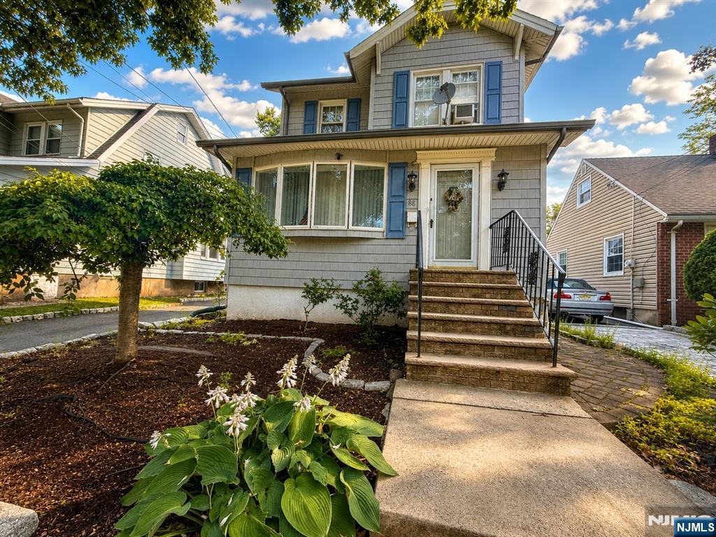 Welcome to this beautifully Colonial on one of Ridgefield Park's most picturesque, tree-lined streets, known for its iconic annual Fourth of July parade and timeless charm. This spacious home offers 3 BRs plus a finished walk-up attic with a full bath and dedicated office, providing flexible space for guests, remote work, or hobbies. The inviting LR features beautiful hardwood floors and elegant French doors leading to the DR, which opens to the kitchen with granite countertops, breakfast bar, ample cabinetry, and a convenient powder room. The finished basement offers a separate side entrance, full bath, and additional office/flex space. Outside, enjoy a private backyard designed for entertaining with an outdoor pizza oven. The detached garage has been converted into a sports bar-inspired entertainment space, perfect for hosting friends and watching the big game. Situated in the historic Village of Ridgefield Park, this home offers the ideal balance of neighborhood charm and commuter convenience. Enjoy easy access to NYC via nearby NJ TRANSIT bus service and major highways including I-95, Routes 46, 80, 17 & 4. Conveniently located near shopping, dining, parks, and entertainment, including Overpeck County Park, American Dream, and The Shops at Riverside. A rare opportunity offering character, flexible living space, and an exceptional location.