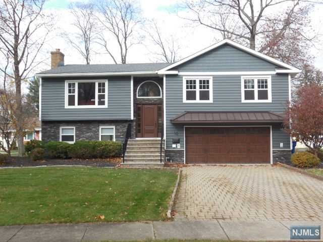 Move in condition,large spacious expanded Bi-level with an open floorplan. Home has been completely renovated throughout in the past couple of years with many upgraded amenities.Large eat in kitchen with lots of cabinet space,new master & main bathrooms with heated floors,closet organizers in all bedroom closets,new roof,front door,railings & sliding doors,insulated back vinyl & cultured stone siding & energy efficient insulation throughout, new recessed lighting throughout also all new exterior lighting,interior doors & trim work,front & side windows,new garage door with battery backup. Tankless H/W BB heat & hot water 2 zones,central air,upgraded 200-amp electrical panel.Sliders off dining room to covered deck overlooking the back yard.Lower level has a huge front to back family room with electric fireplace,pergo flooring & sliders to a patio & back yard.Large bedroom with a full bath. Perfect In-Law suite if ever needed.Laundry room & door to large 2 car garage.