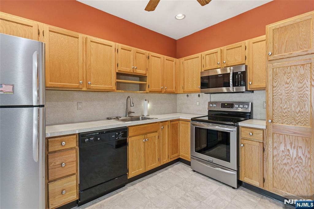 Welcome to Bald Eagle Commons, West Milford's most sought-after 55+ community. This beautifully maintained 2-bedroom, 2-bath Greenbriar unit offers 1,273 square feet of comfortable, single-floor living designed with both function and ease in mind. Step inside to find a bright and spacious layout featuring a formal dining room, a generous living room perfect for relaxing or entertaining, and an eat-in kitchen with ample cabinet and counter space. The primary suite is a true retreat, complete with a large walk-in closet and a private full bath. A second bedroom and full bath offer flexibility for guests, a home office, or whatever suits your lifestyle. In-unit washer and dryer included. Located in Building 5 with convenient elevator access, this unit includes a dedicated parking space conveniently located near the front door, plus a large storage cage for all your extras. Snow removal from your car in winter is just one of the thoughtful perks this community offers. Residents enjoy an impressive array of amenities including an outdoor pool, clubhouse, tennis and pickleball courts, bocce, shuffleboard, jogging paths, and a full social calendar. Each building features its own library, card room, and party space, so there is always something to do right at your doorstep. This is low-maintenance living at its finest, in a vibrant community that truly has it all. Schedule your private tour today and come see why people love calling Bald Eagle Commons home.