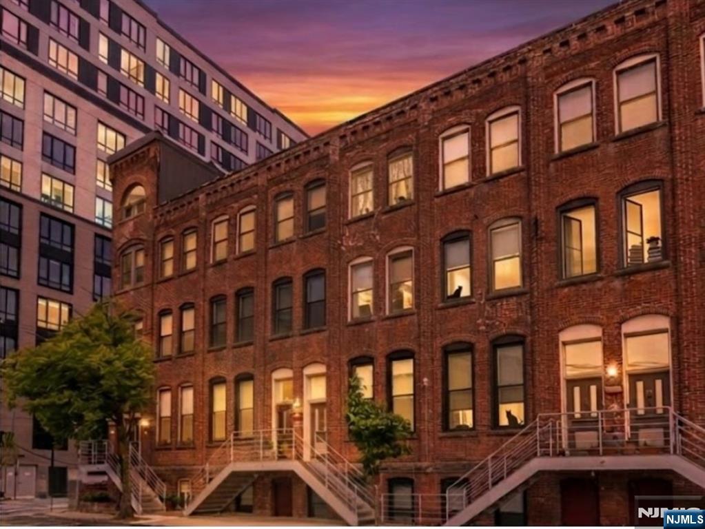 Some homes connect you to the city. This one connects you to the world. Welcome to Unit 105 at the historic Chocolate Factory, a distinctive bi-level residence with private street-level entry, cathedral ceilings, east- and west-facing windows, exposed timber columns, one bedroom plus flexible clo?ce, 1.5 baths, in-unit laundry, and assigned covered parking. Just two blocks from Newark Penn Station, the home places NJ Transit, PATH, Amtrak, and Newark Liberty International Airport within easy reach, while the Ironbound's restaurants, caf s, bakeries, and global neighborhood culture unfold outside your door. As FIFA energy fills the region, the Ironbound brings that international spirit home. Inside, the bi-level layout separates living from retreat, with open living, dining, kitchen, and powder room above, and bedroom, full bath, and clo?ce below. Set within a preserved 1888 landmark with a tranquil interior courtyard, Unit 105 o?ers historic character, practical ease, and exceptional connectivity. Freshly presented and best experienced in person. Highest & Best due on Monday July 13th no later than 5pm.