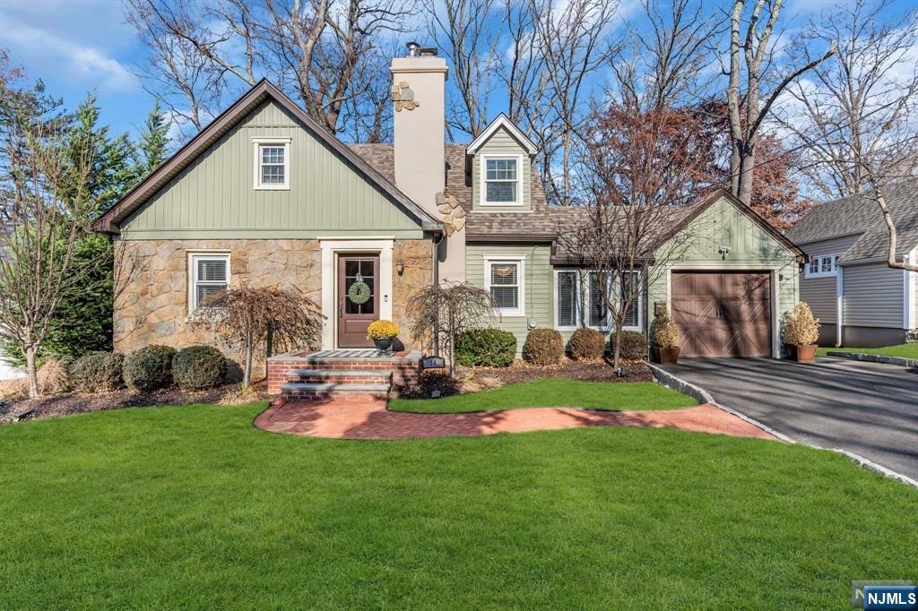 Discover timeless charm and unmatched curb appeal in this meticulously maintained Colonial Cape, nestled in the highly sought-after Burnet Hill neighborhood. As you step inside, elegant archways frame the formal living room, complete with a cozy wood-burning fireplace. The main floor also features a spacious family room, a formal dining room, a generously sized bedroom, and a full bath for added convenience. Upstairs, the en-suite primary bedroom offers a serene sitting area and a walk-in closet, accompanied by an additional bedroom and attic storage. The fully finished basement extends the living space with a large recreation room, an office/bedroom, a separate laundry room, and ample storage.
