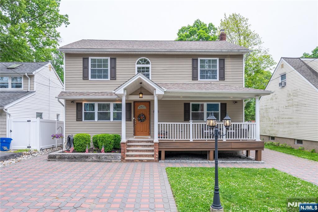 Welcome home to this impeccably updated Colonial, where timeless architectural character seamlessly blends with a sleek, modern open layout. Designed for effortless daily living and entertaining, the main level boasts gleaming hardwood floors and sun drenched spaces. The heart of the home is the stunning kitchen, with beautiful granite countertops, stainless steel appliances, and a layout that flows naturally into the main living areas. Retreat upstairs to the serene primary suite, featuring a luxurious, beautifully tiled en-suite bath. Downstairs, the spectacular finished basement offers incredible bonus living space perfect for a home theater, gym, or playroom. Step outside to your private backyard, where a spacious deck overlooks a fully fenced yard, offering the perfect backdrop for summer barbecues and peaceful relaxation. From the gorgeous paver driveway to the pristine tiled baths and turnkey finishes throughout, this home leaves absolutely nothing to do but move right in!