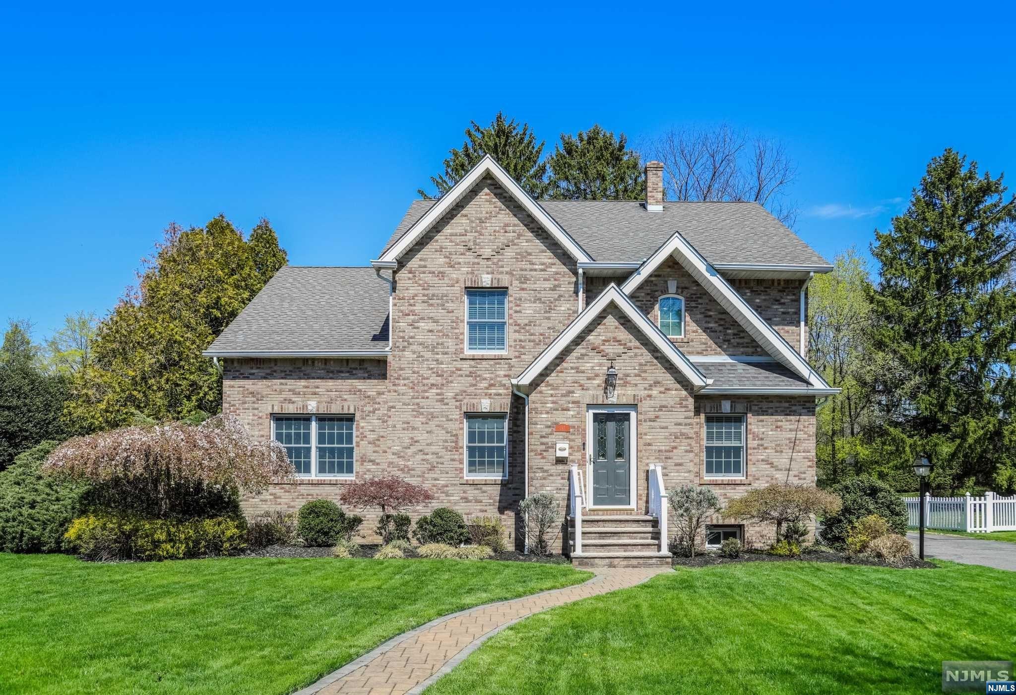 Outstanding 5 bedroom Colonial in one of the most charming and convenient neighborhoods in Ridgewood - down the street from Elementary, tennis courts, and Van Dyke's Ice Cream! Blocks away from NYC bus/train, Whole Foods, Middle School, restaurants, and shops. An extensive renovation expanded this custom home with all the modern amenities - great open floor plan filled with light, spacious rooms with hardwood floors, and flexible living space. Entertaining is a breeze with a fantastic chef's kitchen sporting professional appliances and a large Island, open to den with built in bar, and vaulted family room with expansive view and access to private backyard. This room is flooded with natural light! Two first-floor bedrooms and a full bath are perfect for office space and guest accommodations. The second floor boasts a beautiful primary suite and two additional bedrooms, all spacious, with walk in closets. Unbelievable storage throughout! Finished lower level w/rec rm, game/fitness.