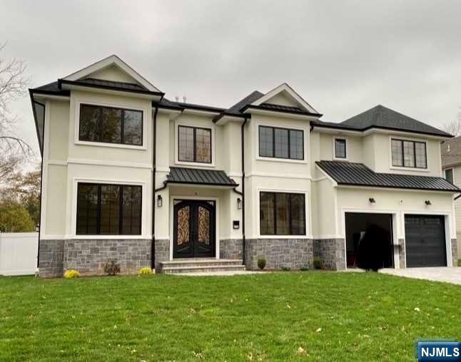 Stunning 6000SF+ BRAND NEW CONSTRUCTION!! READY FOR FALL! 2022. Upon completion this home will feature 6 bedrooms and 5.5 baths! This masterpiece will be built on a brand new foundation. First floor boast 10 foot ceilings with a 2 story foyer and 2 story great room with a gas fireplace, kitchen features professional sub-zero appliances and wet bar, 1st floor guest room with en-suite bathroom, 2nd floor features master bedroom with vaulted ceilings and an additional 3 bedrooms and 2 full baths, finished basement features a movie theater, bedroom and full bath and plenty of space to entertain and room for home gym! Home features so much more on the desirable East Side of Paramus!!!! Amenities Galore!!!! Don't miss your chance to own this exquisite home!