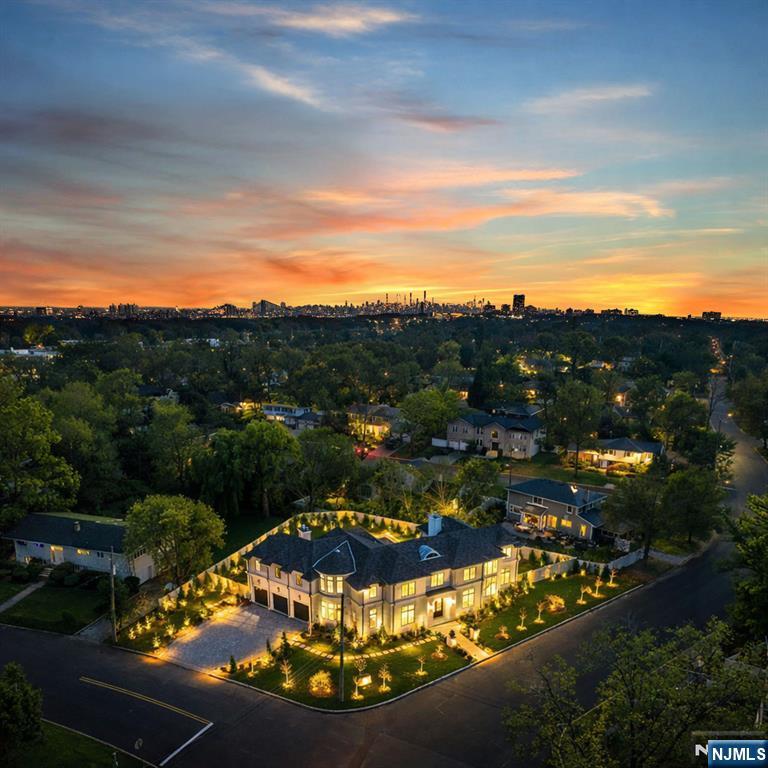 virtual tour link: https://newjerseyproper.com/645-summit-st-englewood-nj/ Call Jason Pierce 201 397 5888 or Richard Orlando 551 486 2065 with any questions. Welcome to North Cliffs newly constructed Modern Chic French Colonial with over 11,000 square feet of unmatched style designed by renowned architect Jordan Rosenberg and award winning interior designer Vanessa DeLeon. Less than 10 min to NYC a rare sanctuary with resort-like living,will impress even the most discerning buyer. Situated on an oversized 18,000 sqft corner oversized lot with interest on all angles, this ultra lux home offers 6 bedrooms 7 Full baths and 2 half baths with an uncompromising attention to detail. 1st flr junior suite. 2 home offices positioned on the 1st and 2nd level! 2nd flr living room with coffee bar. Elevator for all 3 flrs and backup generator. Inground saltwater pool with spa, outdoor kitchen/ covered patio and professionally designed landscaping. Completion date Q4 2025, this home will truly be in a class of its own.