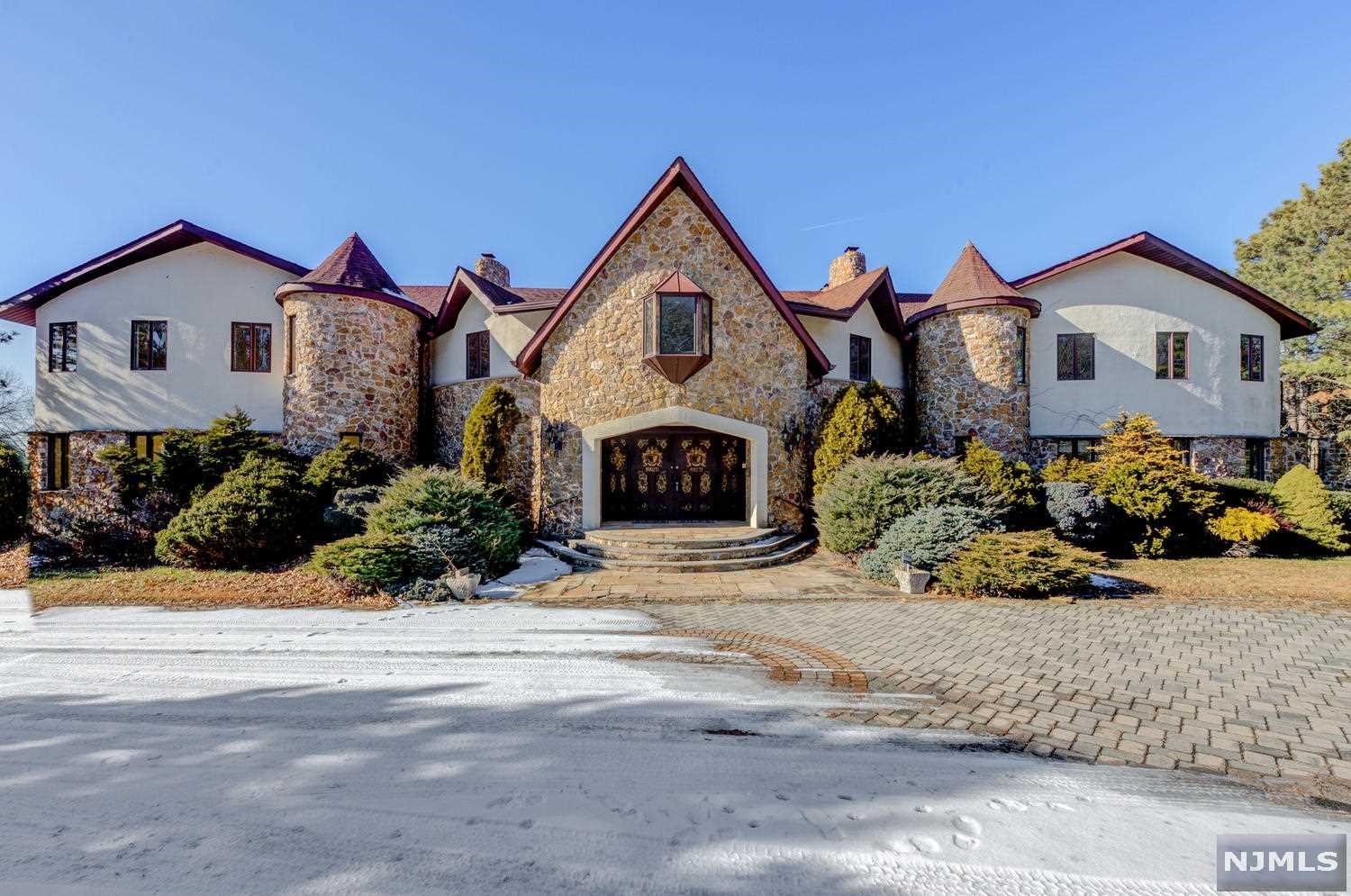 This almost 10,000 sf grand home is in need of renovation and looking for a new owner to restore it to its former glory. New 2021 Tax Assessment at $1,400,000. Floor to ceiling windows and soaring ceilings, in-ground pool, sauna, almost one acre of private grounds, too many features to list, must see for yourself! Being sold completely as-is.