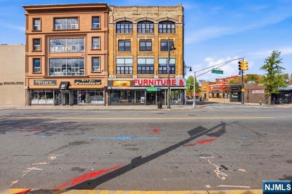 Exceptional investment opportunity in the heart of Paterson! This fully occupied mixed-use building at 231 Market Street offers immediate cash flow and long-term upside for the savvy investor. The property features nine well-maintained one-bedroom residential units, all currently rented, providing stable and consistent income. The ground floor is occupied by an established furniture retail store, adding a strong commercial component and additional revenue stream. This prime location benefits from high foot traffic, excellent visibility, and close proximity to major highways, public transportation, shopping, and dining. With 100% occupancy, this turnkey asset is ideal for investors seeking a performing property with minimal downtime. Whether youâ€™re expanding your portfolio or entering the mixed-use market, this property delivers both stability and growth potential. Offered at $3,100,000. Donâ€™t miss this rare opportunity to own a high-performing mixed-use property in a thriving urban location.