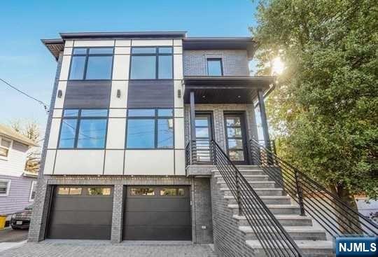 Back on the market: The buyer's mortgage denied. Introducing brick exterior, bright two family, top and bottom modern new construction. (One year young) This home features sun-filled rooms with 9'ceilings throughout. Both first and second floor features spacious living room, modern gourmet kitchen, 3 bedrooms and 2 full bath with a deck. The master bedroom has an en-suite bathroom, complete with a modern glass-enclosed shower. Finished basement offers very large family room, a bedroom recreational/gym etc. sliding door to back yard, side door. This is a great opportunity to live on one floor and rent the other or rent both units for the investors. Great income producing property Near GWB and ALL highways. Short walk to bus to NYC, shopping, supermarkets, schools, dozens of great restaurants