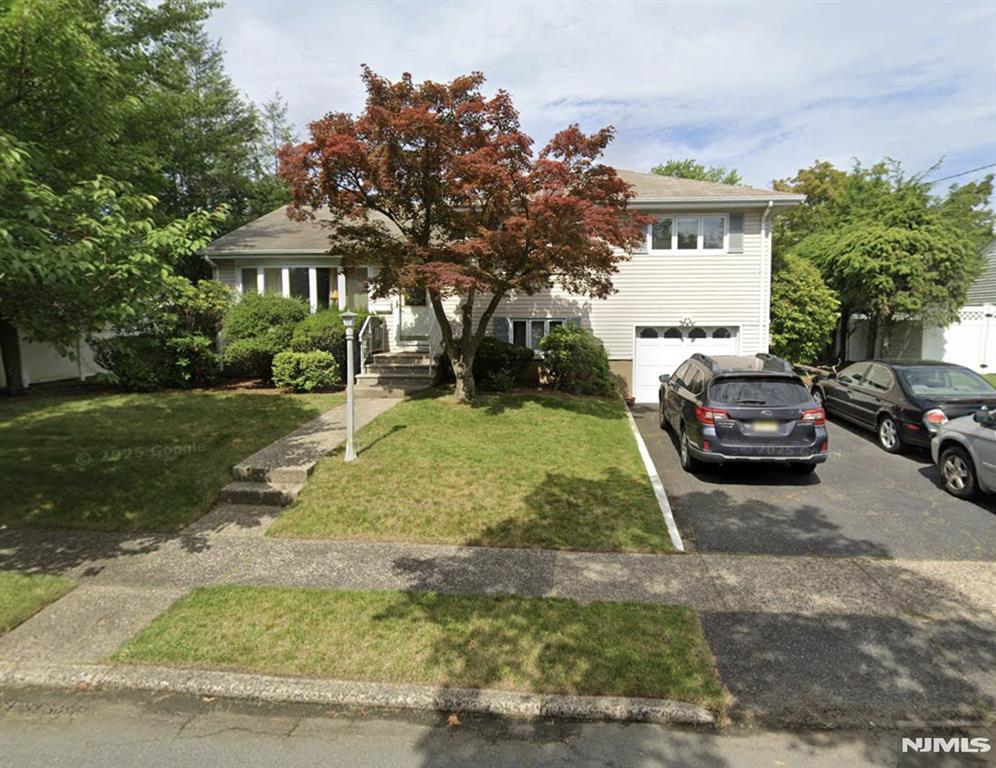 Welcome to 50 Harding Avenue in the unique town of Dumont NJ. This split level home faces East bringing sunshine throughout. It's location is convenient to NYC bus transporation, schools, shopping and many local amenties. The town of Dumont is convenient to all major highways, International airports, shopping centers with brand name outlets & both public and private golf courses. This home offers accessibility while maintaining a comfortable residential feel. The interior layout flows well for everyday living and entertaining with entry from the kitchen to covered rear patio. The backyard is fenced in with mature trees and flowering bushes offering privacy for relaxing and dining.