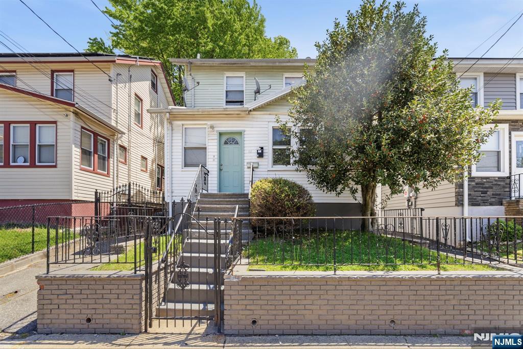 Two-family home located on a quiet one-way residential street in Irvington. This property features a finished basement, separate utilities and heating, a one-car garage, and a spacious 4-car driveway. Conveniently located near major highways, public transportation, shopping, and schools. Excellent opportunity for both investors and owner-occupants!