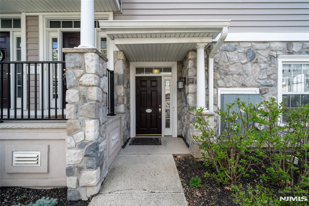 Welcome to this spacious and beautifully updated two-bedroom, two-bathroom condo in the highly sought-after Cambridge Crossing community. Step through the front door into an expansive open-concept living and dining area, featuring a cozy gas fireplace and sliding glass doors that lead to your own private patioâ€”perfect for relaxing or entertaining. The updated kitchen boasts elegant granite countertops, a convenient breakfast bar, and abundant cabinetry, offering both style and functionality. Both bedrooms are generously sized, with the primary suite featuring a private en-suite bathroom for added comfort. Additional highlights include a separate laundry room and direct access to your private garage. Enjoy resort-style living with Cambridge Crossingâ€™s impressive amenities, including a clubhouse with fitness center, in-ground pool, and tennis courts. Ideally located near NYC transit, major highways, beautiful parks, and top-rated schools, this home offers the perfect blend of convenience, comfort, and community.