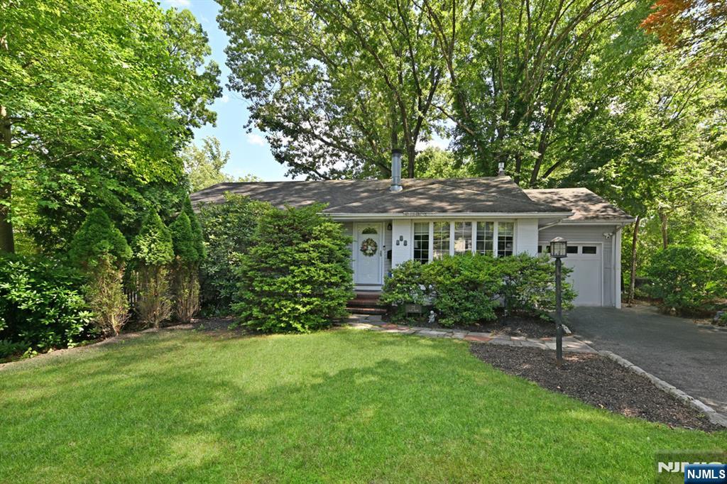 Charming 3-bedroom, 1.5-bath ranch-style home with so much to love! Both bathrooms have been tastefully updated, offering a fresh, modern feel the moment you walk in. The easy single-floor living layout makes this home as functional as it is inviting. Cozy up on cool evenings beside the wood-burning fireplace in the living room â€” the perfect centerpiece for relaxed gatherings. Downstairs, the finished basement is full of possibility â€” imagine the recreation room, home gym, or entertainment space you've always wanted. A cozy wood stove in the corner adds warmth and charm to whatever vision you bring to life. Step outside to a fully fenced backyard, ideal for everyone to enjoy. And just steps from your front door sits a charming neighborhood play area, complete with swings and a jungle gym â€” a sweet little bonus that makes this location truly special. This well-loved ranch is ready for its next chapter. Come see it for yourself!