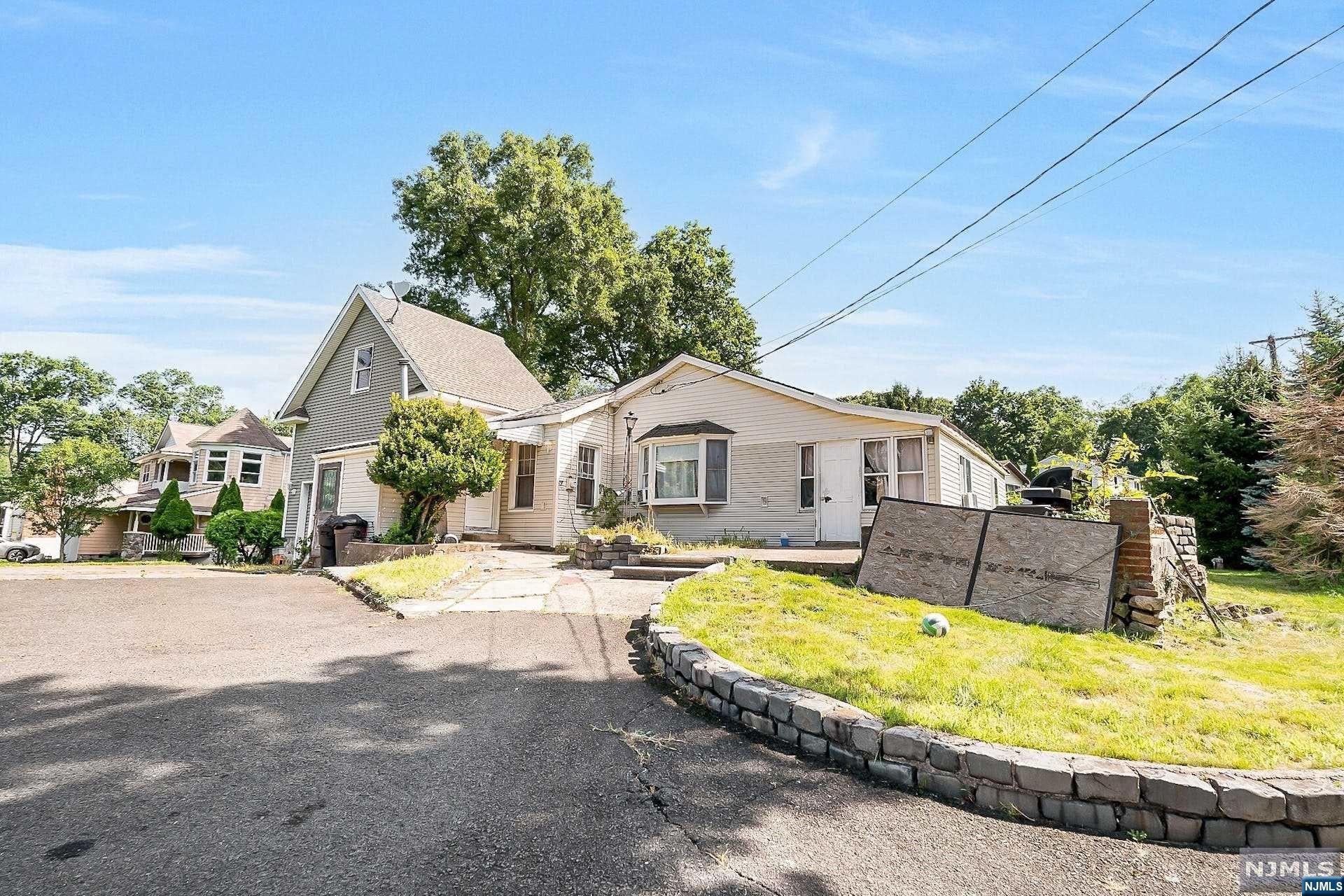 Don't miss this opportunity to get into a LARGE ranch in beautiful North Haledon! House is located on prime corner property on a dead-end block with large expansive lot. Unlike most ranches, this house boasts an incredibly large living room with 20 ft ceilings. All bedrooms are large sizes, kitchen is large as well, and there is even a bonus room off the one bedroom that can be used as a playroom/office/etc. The house needs some work and TLC, but it's been priced appropriately to reflect that. In this market climate, this house is perfect for someone who is handy. Bring those offers; this house WILL NOT LAST LONG!!!