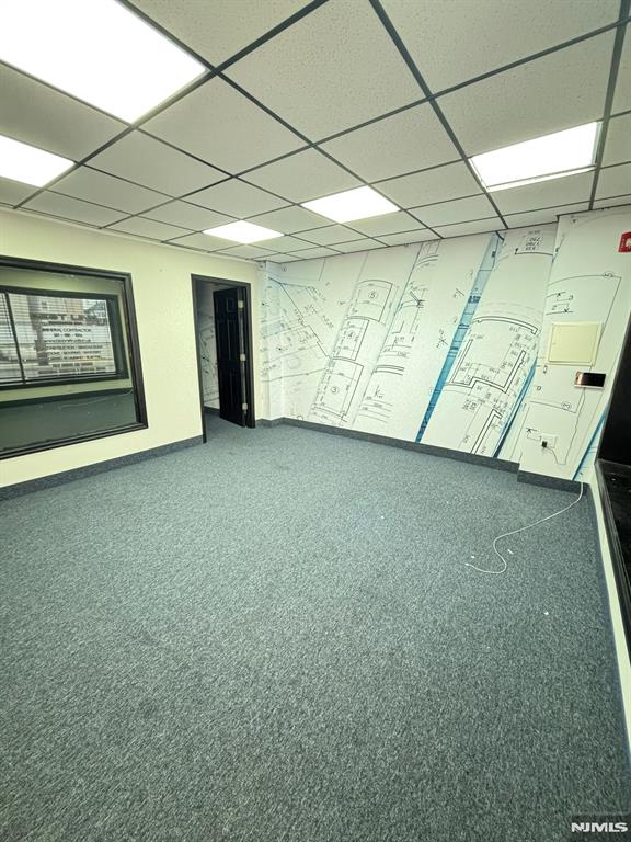 Highly visible corner spot with new floors (carpeting), paint and updated half-bathroom. Lots of natural light, one off street parking space included. Zoned as M-1- can be great as an office, showroom or social club. Landlord will pay for a change of use variance.