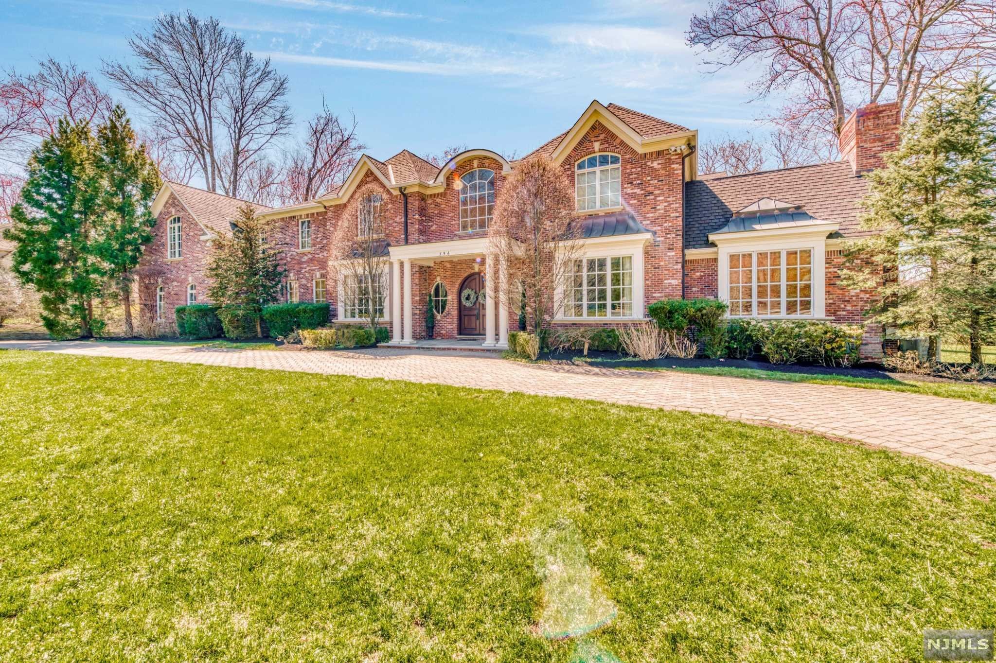 Grand living at 356 Indian Trail Drive! Refined all brick colonial designed and built by region's most highly acclaimed builder. This mini estate is located in West Gate Urban Farms on 1.31 unparalleled private and lushly landscaped acres that back up to the Greenacres Preserves. Stunning 2-story marble floored foyer opens to an elegant great room w/walls of windows,wet bar& FPL. Beautiful wood paneled library w/built-ins and FPL , banquet-sized dining room, chef's kitchen w/ center island, breakfast nook, & top of the line appliances, 10 FT ceilings, hardwoods throughout are among the lush features of this home. The second floor is comprised of a remarkable MBR suite w/ FP, his/her closet, sitting room and spectacular MBATH. 4 additional bedroom suites. Very private backyard with bluestone patio, circular paver driveway and more...Very close to center of town and Indian Trail Club